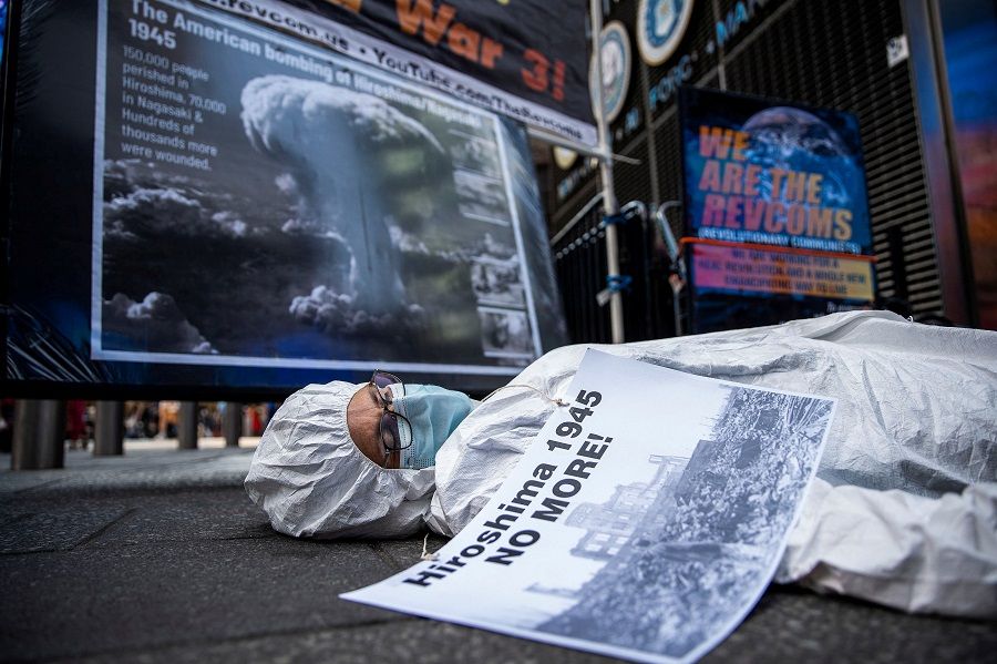 An anti-war demonstrator stages a die-in as others mark the 78th anniversary of the 1945 atomic bomb attack on Hiroshima with a march and protest at Times Square in New York, US, on 6 August 2023. (Eduardo Munoz/Reuters)