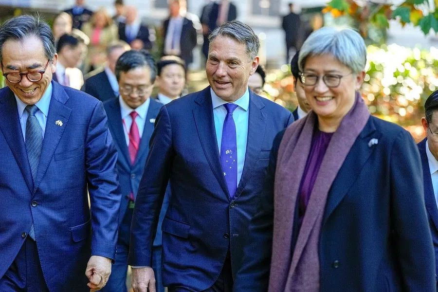 Australia’s Foreign Minister Penny Wong (right) along with Deputy Prime Minister and Defence Minister Richard Marles (centre) escort South Korea’s Foreign Minister Cho Tae-yul (left) for an Australia and South Korea Foreign and Defence Ministers meeting in Melbourne on 1 May 2024.  (Asanka Brendon Ratnayake/Pool/AFP)