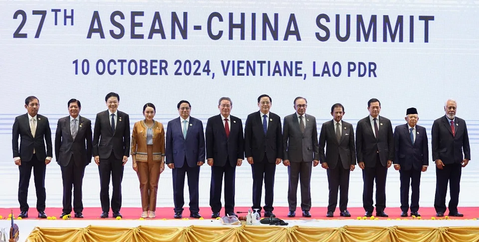 (L-R) Myanmar’s Permanent Secretary of Foreign Affairs Aung Kyaw Moe, Philippines President Ferdinand Marcos Jr, Singapore’s Prime Minister Lawrence Wong, Thailand’s Prime Minister Paetongtarn Shinawatra, Vietnam’s Prime Minister Pham Minh Chinh, Chinese Premier Li Qiang, Laos’ Prime Minister Sonexay Siphandone, Malaysia’s Prime Minister Anwar Ibrahim, Brunei’s Sultan Hassanal Bolkiah, Cambodia’s Prime Minister Hun Manet, Indonesian Vice President Ma’ruf Amin and Prime Minister of Timor-Leste Xanana Gusmao stand for a group photo during the 27th ASEAN-China Summit at the National Convention Centre in Vientiane, Laos, 10 October 2024. (Athit Perawongmetha/Reuters)