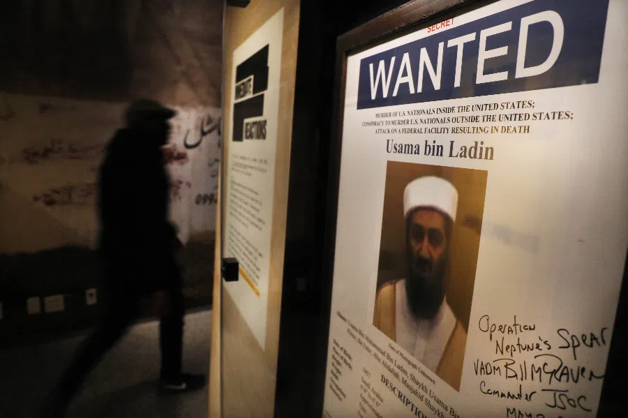 A poster and picture used to identify Osama bin Laden is displayed at the new exhibition Revealed: The Hunt for Bin Laden at the 9/11 Memorial Museum on 7 November 2019 in New York City. (Spencer Platt/Getty Images/AFP)