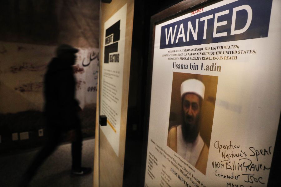 A poster and picture used to identify Osama bin Laden is displayed at the new exhibition Revealed: The Hunt for Bin Laden at the 9/11 Memorial Museum on 7 November 2019 in New York City. (Spencer Platt/Getty Images/AFP)