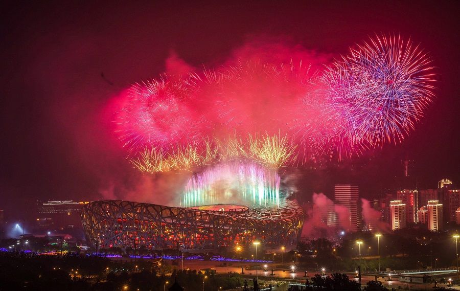 This photo taken on 28 June 2021 shows fireworks exploding during an art performance held at the Bird's Nest national stadium to mark the upcoming 100th anniversary of the founding of the Chinese Communist Party, in Beijing, China. (STR/AFP)