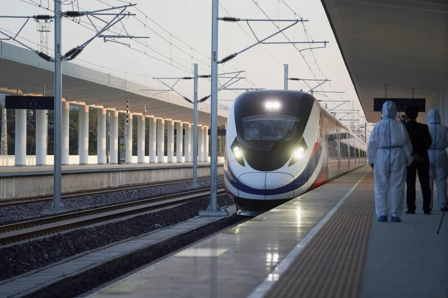 A train is ready on the station during the handover ceremony of the high-speed rail project linking the Chinese southwestern city of Kunming with Vientiane, in Vientiane, Laos, 3 December 2021. (Phoonsab Thevongsa/Reuters)