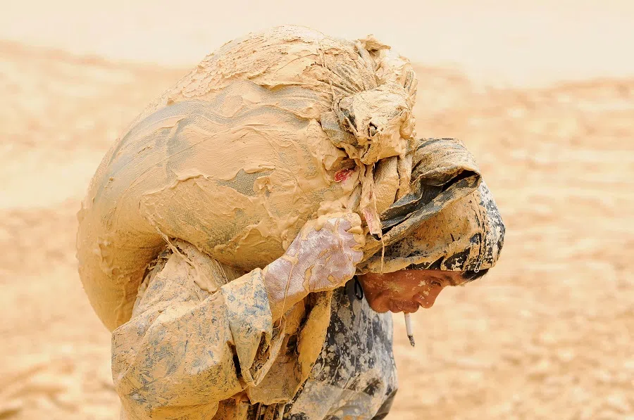 A man works at the site of a rare earth metals mine at Nancheng county, Jiangxi province, China, on 20 October 2010.