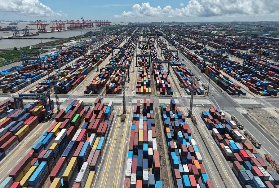 Containers are seen at the port in Shanghai on 12 August 2025. (AFP)