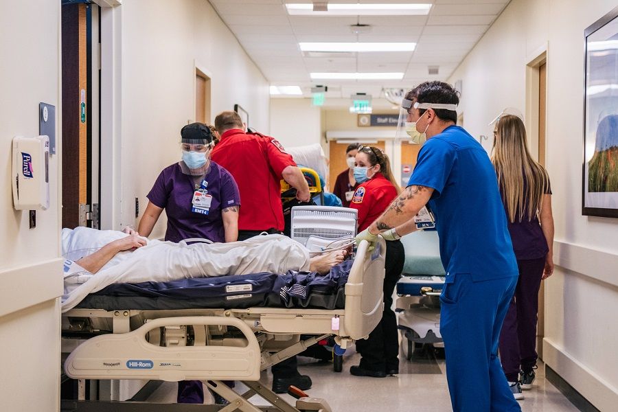 Emergency Room nurses and EMTs tend to patients in hallways at the Houston Methodist The Woodlands Hospital on 18 August 2021 in Houston, Texas, US. (Brandon Bell/Getty Images/AFP)
