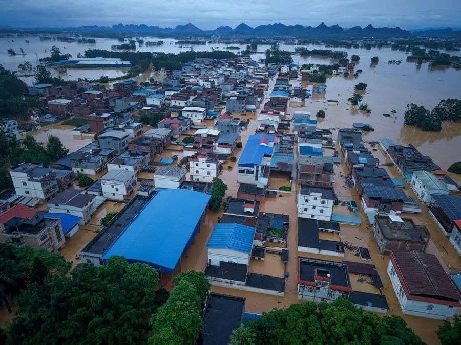 A drone view shows buildings partially submerged in floodwaters after heavy rainfall brought by typhoon Maysak, in Hengzhou, Guangxi Zhuang Autonomous Region, China, 6 July 2026.