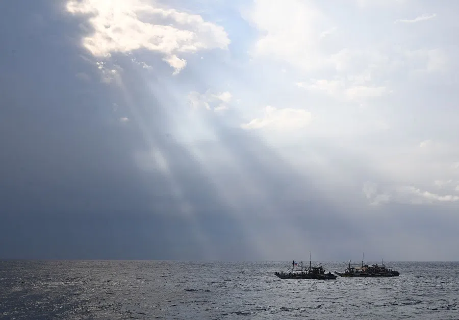 In this photo taken on 15 May 2024, Philippine fishermen sail in the South China Sea.  (Ted Aljibe/AFP)