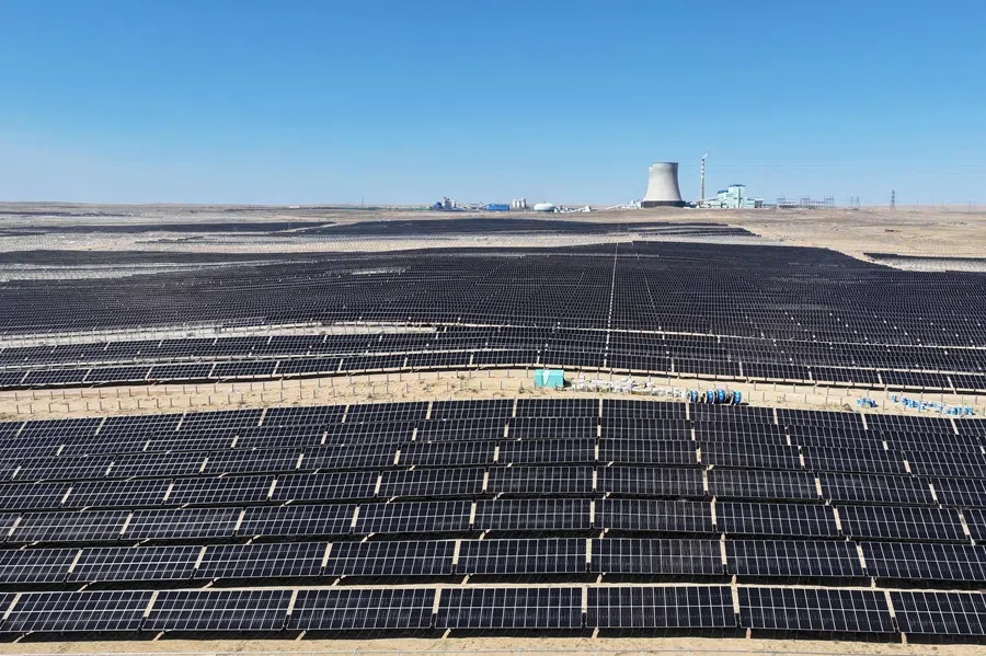 Rows of solar panels are pictured during installation at the Ningguoyun Lingwu 1 million kilowatt photovoltaic project in the desert at Lingwu, in China’s northern Ningxia region, on 14 April 2025.