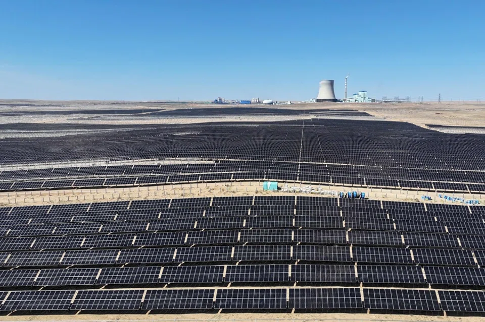Rows of solar panels are pictured during installation at the Ningguoyun Lingwu 1 million kilowatt photovoltaic project in the desert at Lingwu, in China’s northern Ningxia region, on 14 April 2025. (AFP)