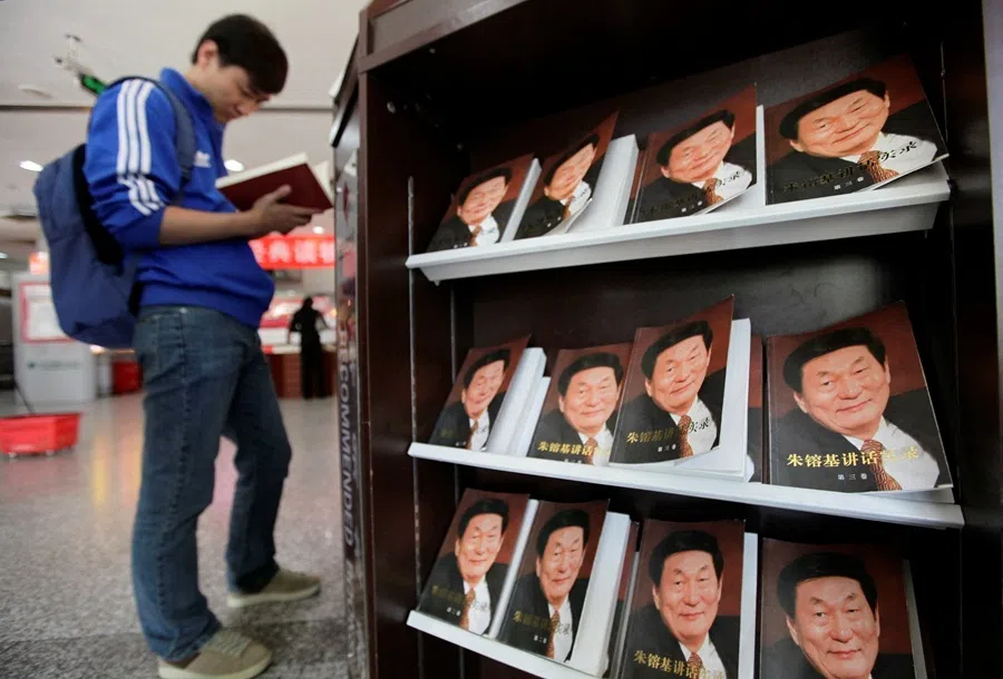 A man browses at a newly published book of China's former premier Zhu Rongji at a bookstore in Beijing on 19 September 2011.