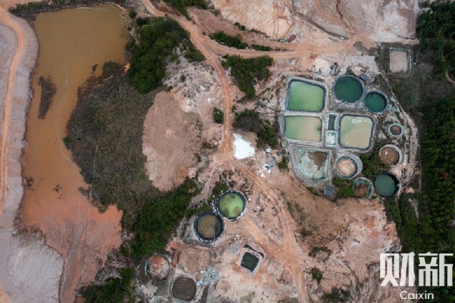 The ponds left by rare earth mining in Longnan city in Ganzhou, China, in March 2022. (Ding Gang/Caixin)