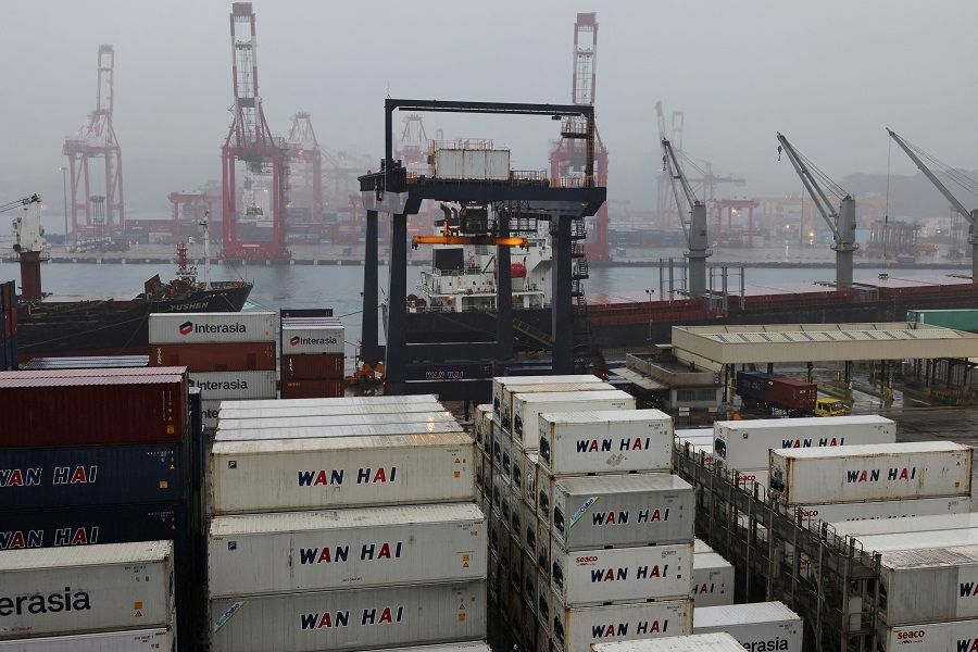 Gantry cranes and containers are seen at the Port of Keelung in Taiwan, 13 February 2023. (I-Hwa Cheng/Reuters)