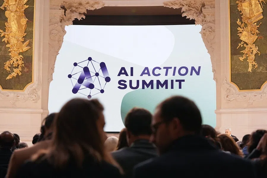 Attendees at the AI Action Summit in Paris, France, 11 February 2025. (Nathan Laine/Bloomberg)