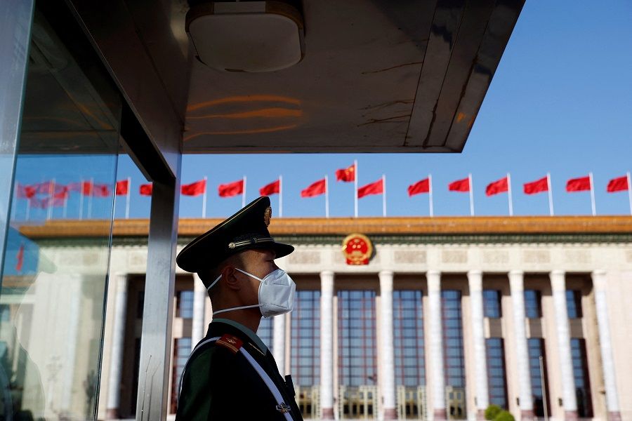 A paramilitary police officer stands guard outside the Great Hall of the People before the opening ceremony of the 20th Party Congress of the Communist Party of China in Beijing, China, 16 October 2022. (Thomas Peter/Reuters)
