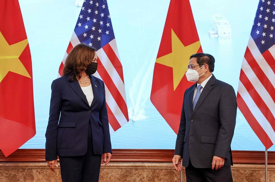 US Vice President Kamala Harris (left) and Vietnamese Prime Minister Pham Minh Chinh meet in the Government office in Hanoi, Vietnam, on 25 August 2021. (Evelyn Hockstein/Pool/AFP)