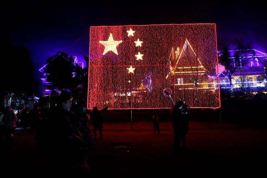 A giant Chinese national flag comprised of light bulbs is seen during a celebration event on New Year's Day, amid the coronavirus disease (COVID-19) outbreak, at a park in Wuhan, Hubei province, China, 1 January 2021. (Tingshu Wang/REUTERS)
