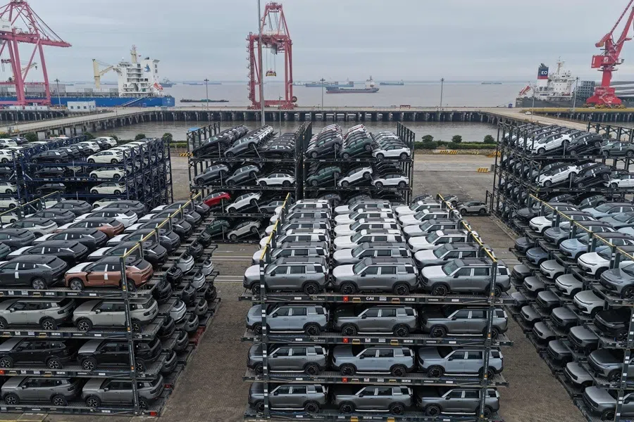 Chinese-made cars are seen in specialised vehicle racks in preparation for loading onto ships for export, at the Taicang Port area of Suzhou Port, in Chinas eastern Jiangsu province on 12 October 2026.