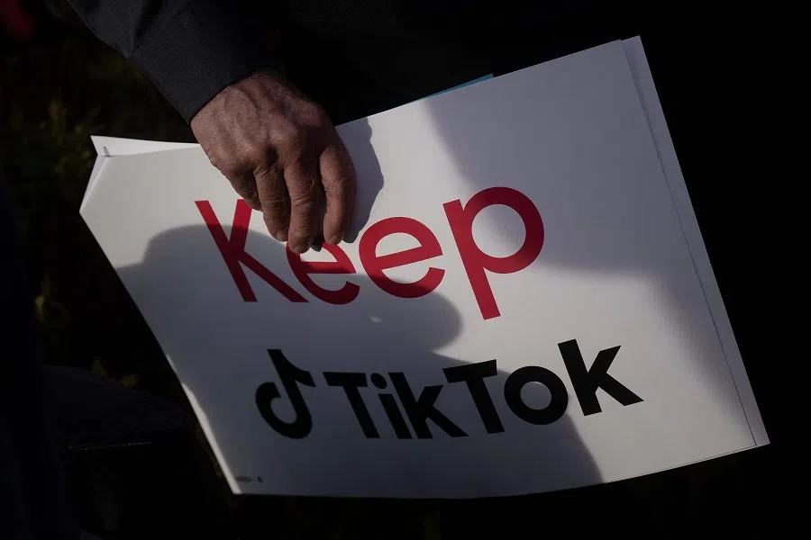 A person holds a sign during a press conference about their opposition to a TikTok ban on Capitol Hill in Washington D.C. on 22 March 2023. TikTok faces a US ban after an appeals court on 6 December 2024 rejected its challenge to a law requiring the video-sharing app to divest from its Chinese parent company by 19 January 2025. (Brendan Smialowski/AFP)
