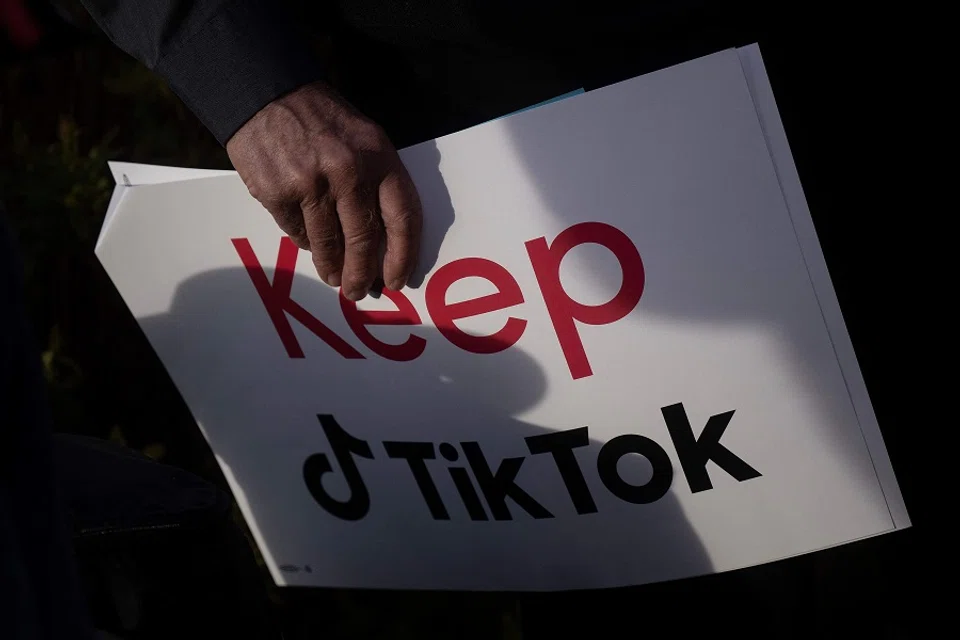A person holds a sign during a press conference about their opposition to a TikTok ban on Capitol Hill in Washington, DC, on 22 March 2023. (Brendan Smialowski/AFP)