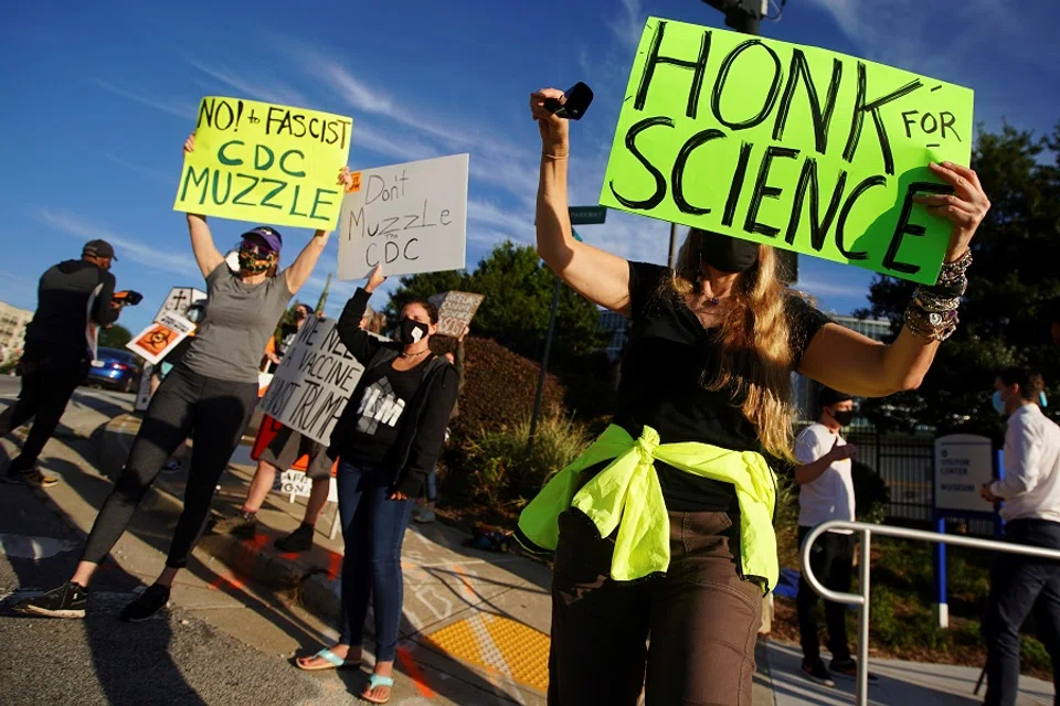 Protesters against US President Donald Trump rally outside the Centers for Disease Control and Prevention (CDC) in Atlanta, Georgia, US, 21 September 2020. (Elijah Nouvelage/Reuters)