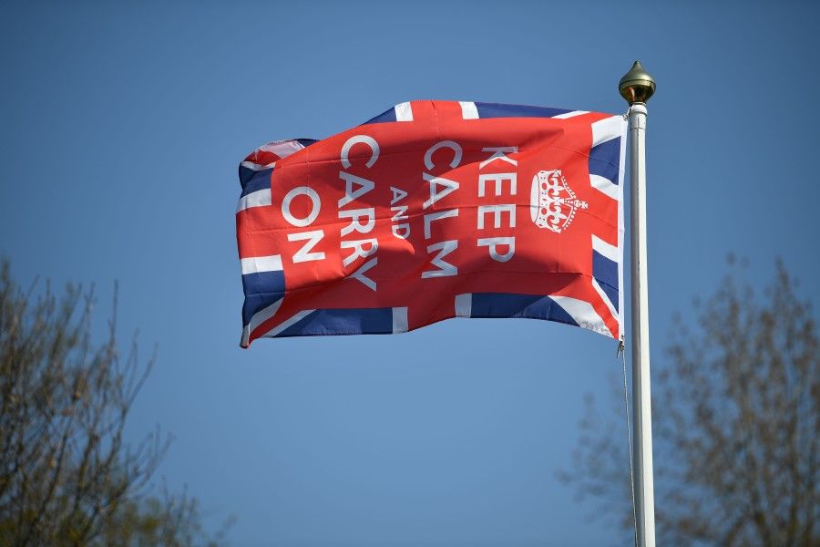 A Keep Calm and Carry On flag flies in the garden of a home in Bodiam, southern England, 9 April 2020. China-Britain ties have cooled in the past few months. (Ben Stansall/AFP)