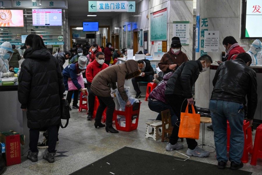 People wait for medical attention at Wuhan Red Cross Hospital in Wuhan on January 25, 2020. The Red Cross Society in Wuhan and Hubei have been criticised for poor distribution of medical supplies. (Hector Retamal/AFP)