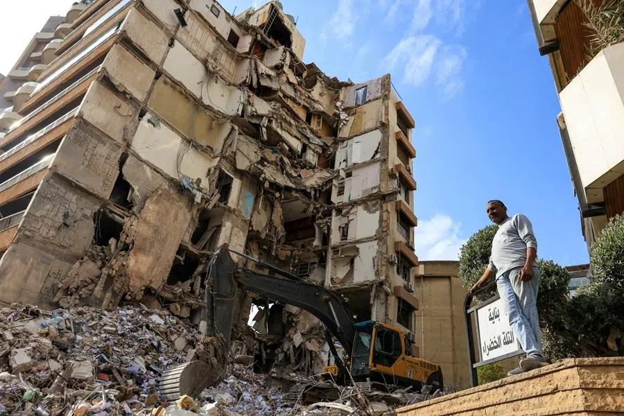 A man stands near a damaged building at the site of an Israeli strike carried out on Wednesday, in Tallet El Khayat in Beirut, Lebanon, on 9 April 2026. (Raghed Waked/Reuters)