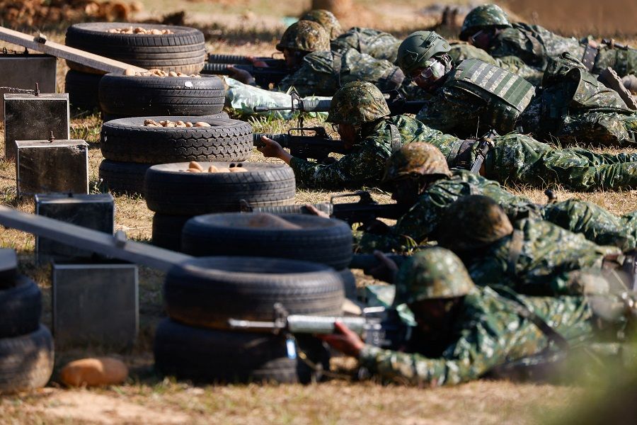 Taiwan's compulsory servicemen demonstrate their combat skills to the media at a military base in Taichung, Taiwan, 23 November 2023. (Ann Wang/Reuters)