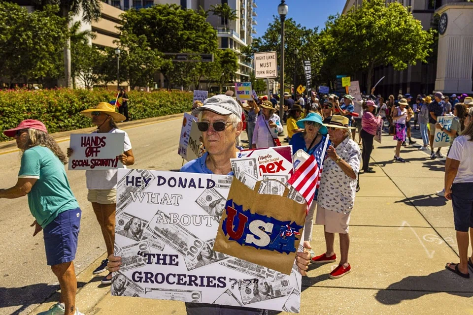 Demonstrators during a “Hands Off” protest against the Trump administration in West Palm Beach, Florida, US, on 5 April 2025. (Saul Martinez/Bloomberg)