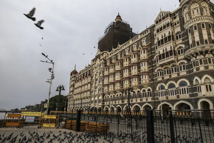 The Taj Hotel stands beyond a deserted street during a lockdown imposed due to the coronavirus in Mumbai, India, on 1 June 2020. (Dhiraj Singh/Bloomberg)