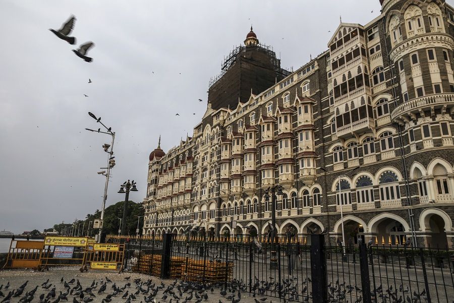 The Taj Hotel stands beyond a deserted street during a lockdown imposed due to the coronavirus in Mumbai, India, on 1 June 2020. (Dhiraj Singh/Bloomberg)