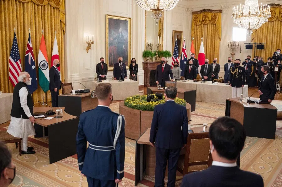 US President Joe Biden (second from left), India Prime Minister Narendra Modi (left), Japan Prime Minister Suga Yoshihide (centre) and Australian Primer Minister Scott Morrison (top, centre) arrive for the the first-ever in-person Quad Leaders Summit at the White House in Washington, DC on 24 September 2021. (Jim Watson/AFP)