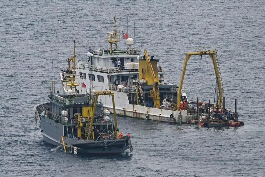 Ships identified by the Philippine Coast Guard as Chinese research vessels are seen at Scarborough Shoal in the disputed South China Sea on 15 June 2026.