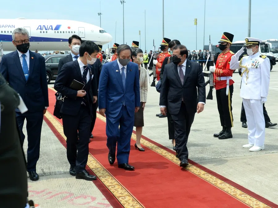 Japan's Prime Minister Yoshihide Suga arrives at Soekarno-Hatta International Airport for departure to Japan, in Tangerang, near Jakarta, Indonesia, 21 October 2020. (Indonesia's Presidential Palace/Handout via REUTERS)