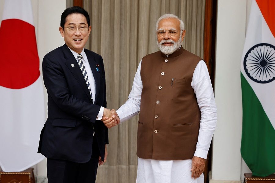 Japanese Prime Minister Fumio Kishida shakes hands with his Indian counterpart Narendra Modi before their meeting at the Hyderabad House in New Delhi, India, 20 March 2023. (Adnan Abidi/Reuters)