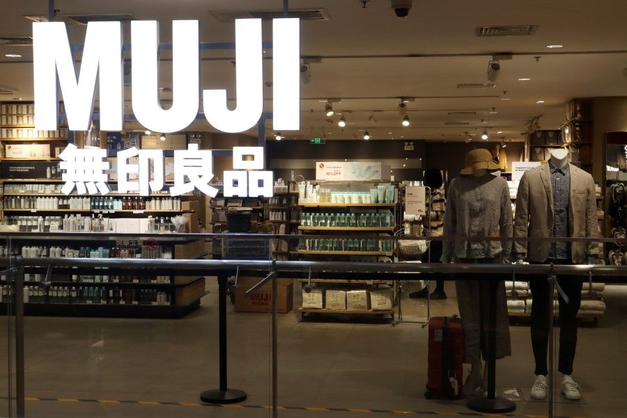 Mannequins stand inside a store of Japanese retailer Muji at a shopping mall in Beijing, China, 25 March 2021. (Florence Lo/Reuters)