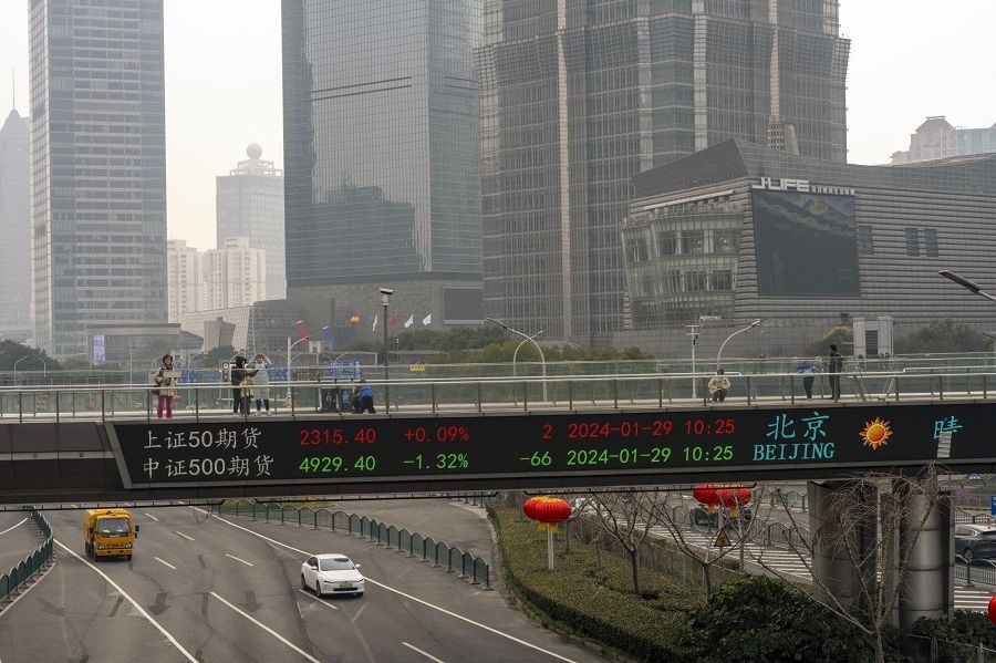 An electronic ticker displays stock figures in Pudong's Lujiazui Financial District in Shanghai, China, on 29 January 2024. (Raul Ariano/Bloomberg)