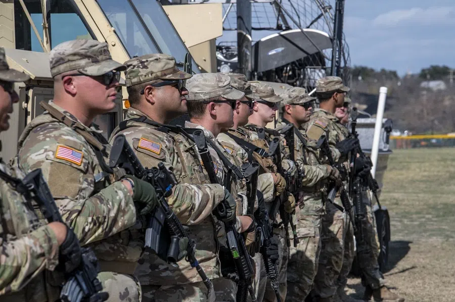 Members of the Texas National Guard before a news conference at Shelby Park along the Rio Grande River in Eagle Pass, Texas, US, on 8 February 2024. (Sergio Flores/Bloomberg)