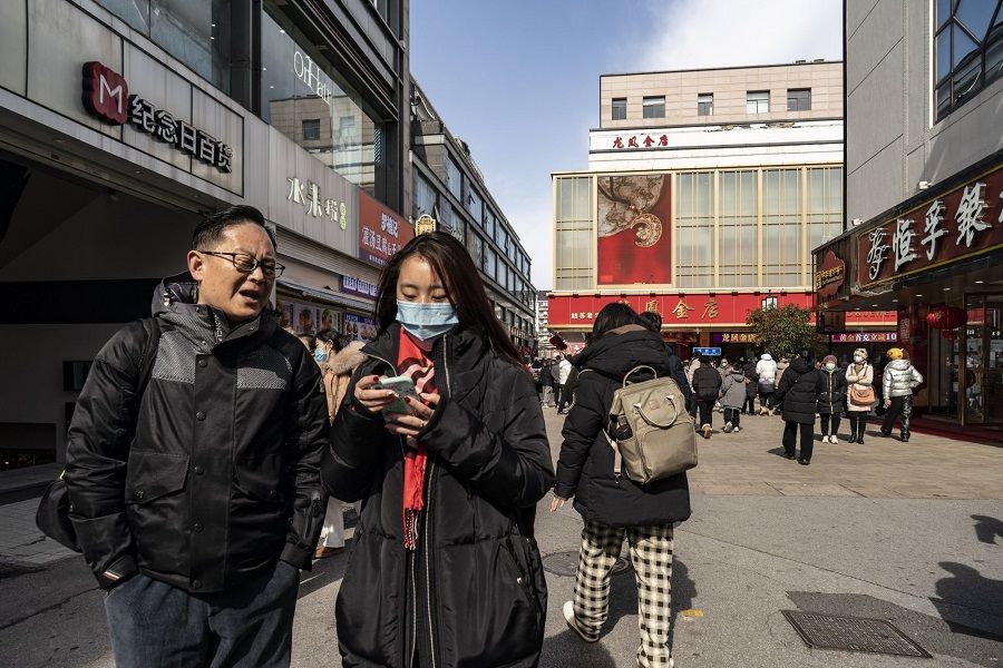 Shoppers in the Guanqian Street shopping area in Suzhou, Jiangsu province, China, on 25 January 2023. (Qilai Shen/Bloomberg)