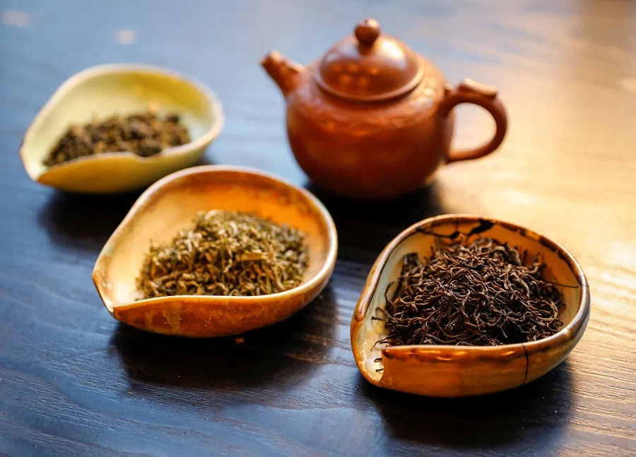 A view shows a pot and utensils with various types of tea leaves in a tea house in this picture illustration taken on 25 April 2020. (Shamil Zhumatov/Illustration/Reuters)