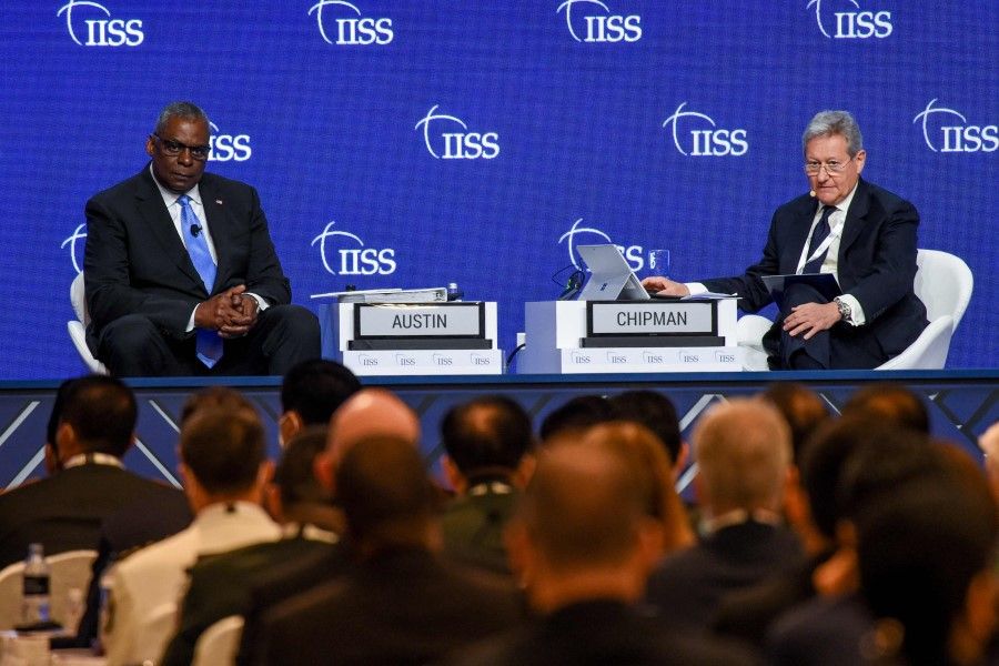 US Defence Secretary Lloyd Austin (left) and International Institute for Strategic Studies (IISS) director-general and chief executive John Chipman (right) take questions from the audience at the Shangri-La Dialogue summit in Singapore on 11 June 2022. (Roslan Rahman/AFP)