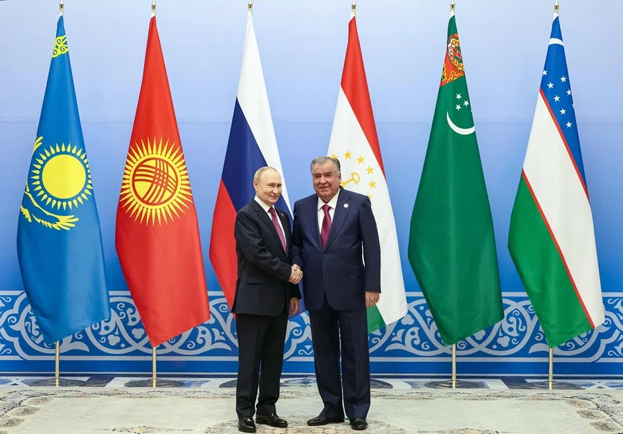 In this pool photograph distributed by the Russian state agency Sputnik, Tajikistan's President Emomali Rakhmon greets Russia's President Vladimir Putin prior to the Central Asia-Russia Summit in Dushanbe on 9 October 2025. (Vladimir Smirnov/Pool via AFP)