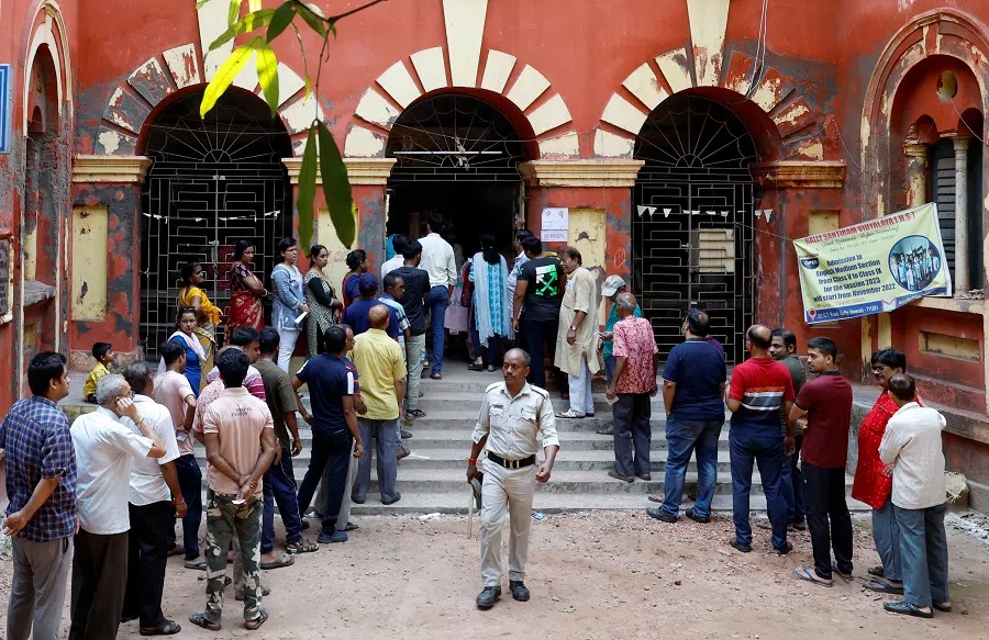 People wait in lines to cast their votes during the fifth phase of India’s general election in Howrah district in the eastern state of West Bengal, India, on 20 May 2024. (Sahiba Chawdhary/Reuters)
