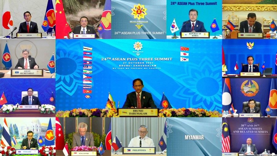 This handout photo released by the host broadcast, ASEAN Summit 2021, on 27 October 2021 shows Sultan of Brunei Hassanal Bolkiah (centre), Japan's Prime Minister Fumio Kishida (top L), Chinese Premier Li Keqiang (top 2nd L) and South Korean President Moon Jae-in (top 2nd R) taking part in the ASEAN-Plus Three Summit on the sidelines of the 2021 Association of Southeast Asian Nations (ASEAN) summit, held online on a live video conference in Bandar Seri Begawan. (Handout/ASEAN Summit 2021/AFP)