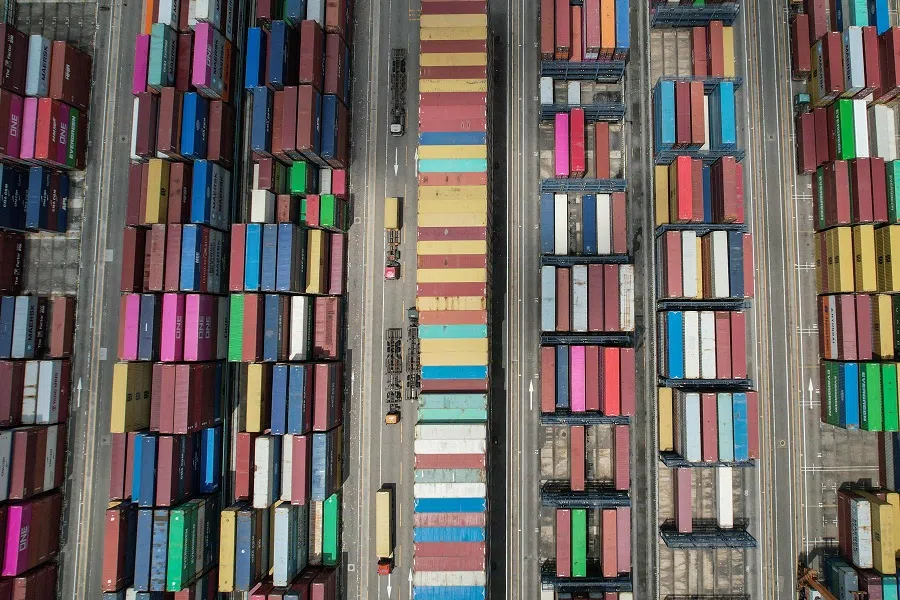 An aerial view shows cargo containers stacked at Yantian port in Shenzhen, in southern China’s Guangdong province on 12 June 2024. (Jade Gao/AFP)