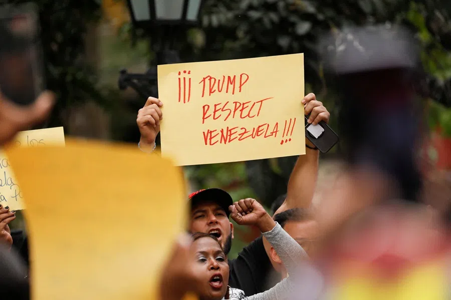 Government supporters participate in a protest against US President Donald Trump's order to blockade sanctioned oil tankers entering and leaving Venezuela, in Caracas, Venezuela, 17 December 2025. (Leonardo Fernandez Viloria/Reuters)
