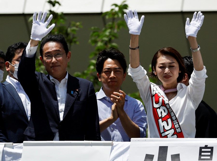 Japan's Prime Minister Fumio Kishida, who is also ruling Liberal Democratic Party (LDP) leader, waves to voters atop of election campaign van with the LDP candidate Junko Mihara and the party lawmaker Shinjiro Koizumi during an election campaign tour for the 10 July 2022 Upper House election, in Kawasaki, south of Tokyo, Japan, 24 June 2022. (Issei Kato/Reuters)