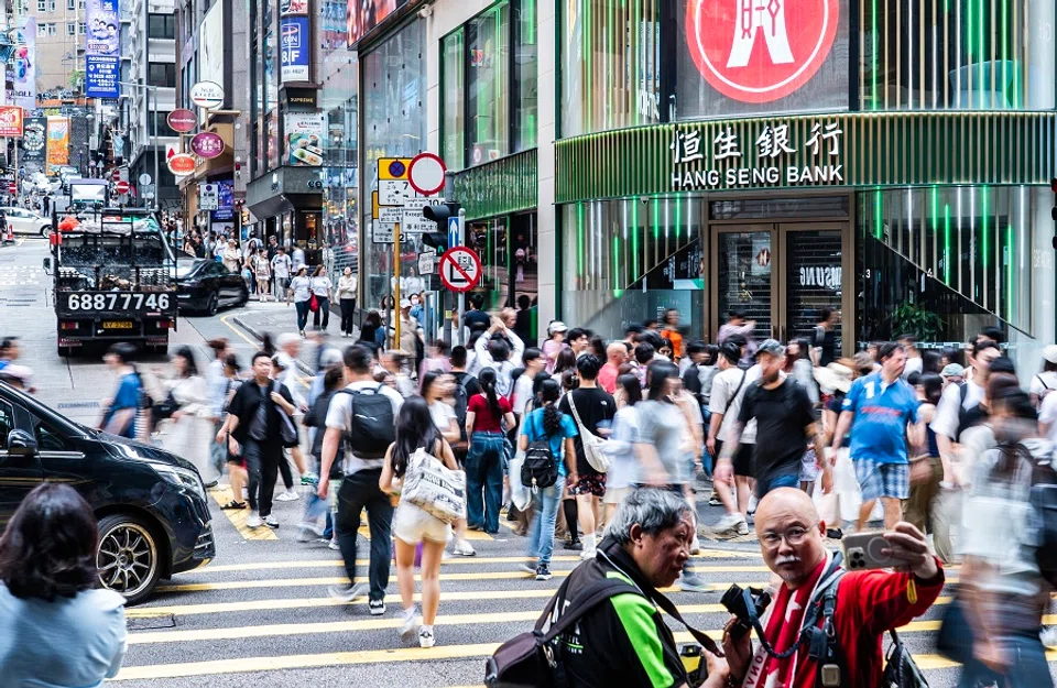 People walk along a street in Central, Hong Kong, on 3 May 2025. (CNS)