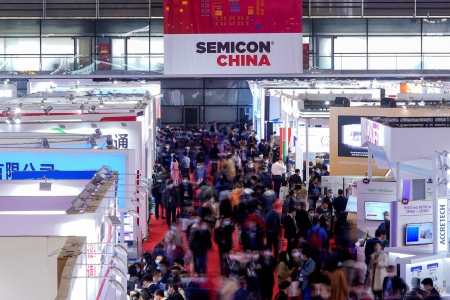 People visit Semicon China, a trade fair for semiconductor technology, in Shanghai, China, 17 March 2021. (Aly Song/Reuters)